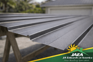 Close-up of a clean straight cut edge on a painted metal roofing panel with no heavy scratches